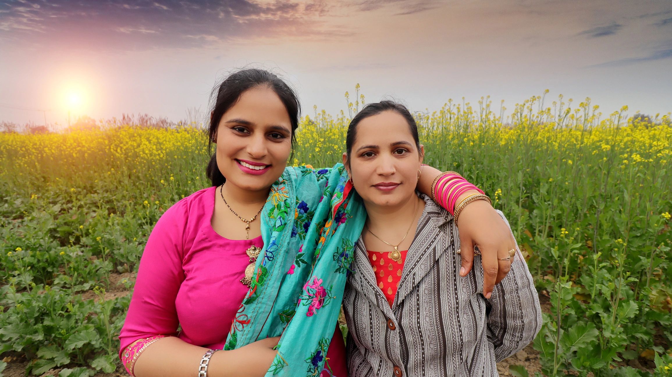 Indian women farmers standing together in a field